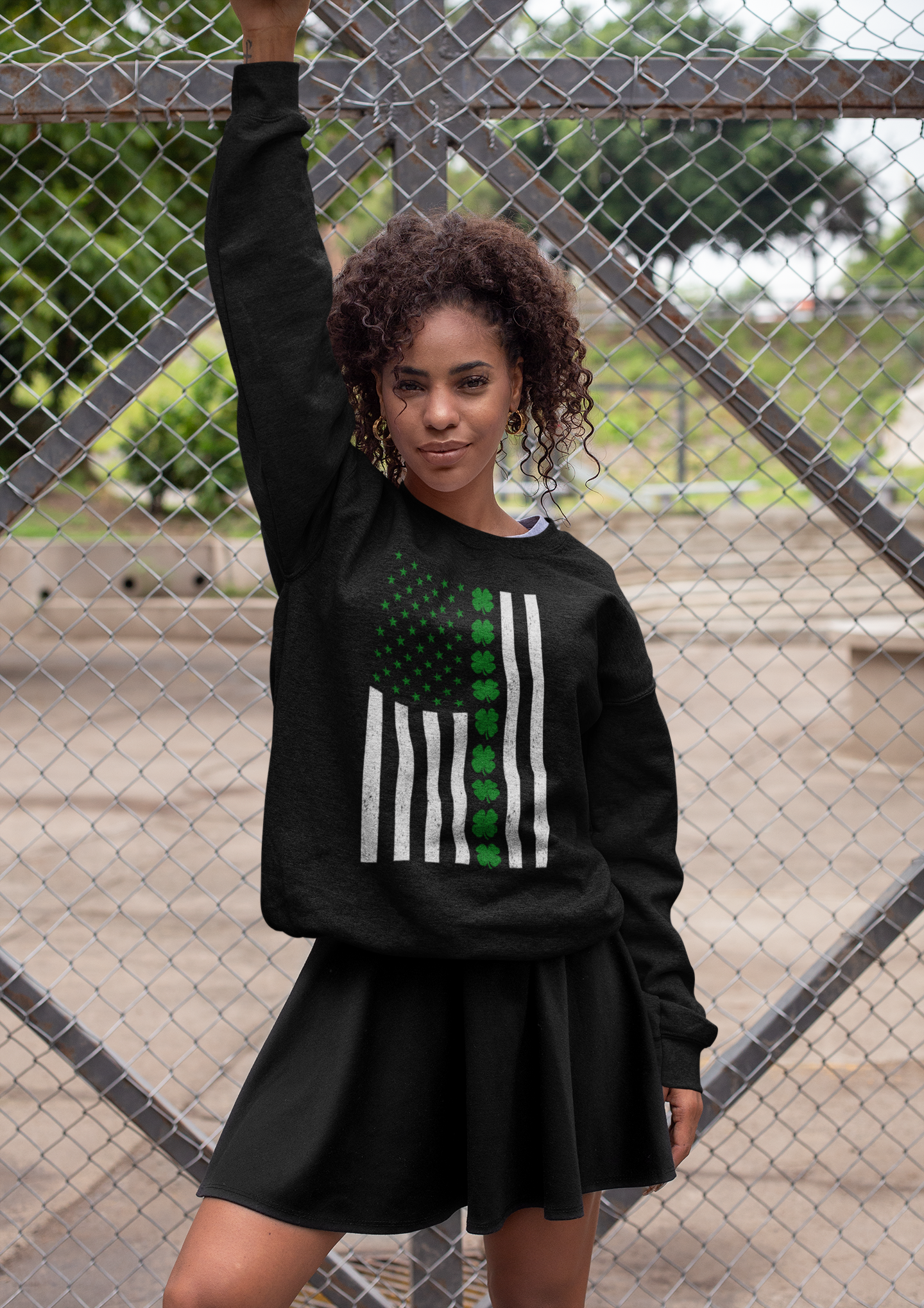 heathered sweatshirt mockup of a woman posing against a wire fence 28642 irish american flag st. patrick's day sweatshirt black